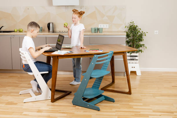 Colorful pediatric hobby chair with adjustable seat and footrest, ideal for domestic or school room use.
